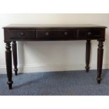 A heavy rosewood side table in William IV-style (later); thumbnail-moulded top above three frieze