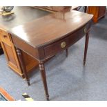 A mid-19th century bow-fronted mahogany side table; the moulded top above a single full-width convex