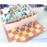 A walnut-banded wooden chess board together with novelty chess pieces modelled as birds