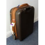 A Delsey travelling suitcase with wheels Dimensions are 67cm high (wheels on the ground) and 46cm