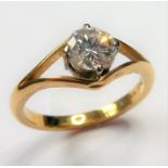 An 18-carat yellow-gold (marked 750) solitaire diamond ring of approx. .60 carats, the bright and