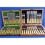 A walnut-cased set of 12 silver-bladed fish knives and 11 hallmarked silver-mounted fish forks (