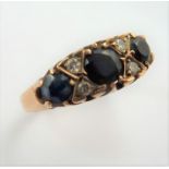 An early 9-carat gold sapphire and diamond ring; ring size M/N (total weight 2.25g) (The cost of