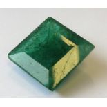 A princess-cut emerald of approximately 19.95 carats (unmounted)