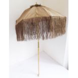 A 19th century silk parasol with turned maple handle