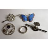 A small silver jewellery/bijouterie group to include Scottish brooch set with an amethyst in a