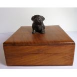 A modern square hardwood box; the lid with a metal handle modelled as a bulldog (probably bronze) (