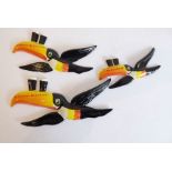 Three porcelain Guiness flying toucans