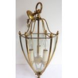 A gilt-metal ceiling hanging lantern; three lights and of tapering hexagonal form