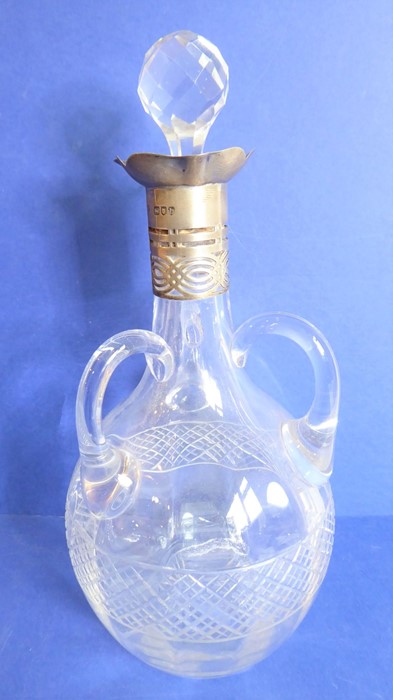 A late 19th / early 20th century Belgian Val St Lambert decanter; having three handles and