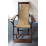 An interesting late 19th / early 20th century planter's or campaign chair; the two shaped arms