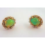 A pair of opal and diamond cluster earrings (The cost of UK postage via Royal Mail Special