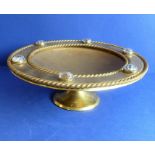 A 19th century heavy gilt-metal (probably gilt-bronze) circular pedestal dish; central engraved