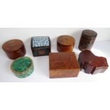 A good selection of mostly treen boxes; to include a circular malachite and copper-mounted