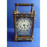 A 19th century brass and champlevé enamel carriage clock; cream ceramic dial with Roman numerals and