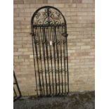 A black-painted wrought-iron gate with arched top (200cm high x 67cm wide)
