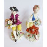 A pair of late 19th / early 20th century hand-decorated German porcelain figures modelled as a young