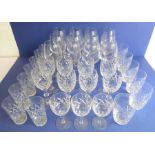 A good selection of cut-glass drinking glasses and wines