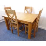 A good and modern light-oak kitchen-style dining table having cleated ends and square legs (139cm