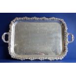 A large and heavy two-handled silver-plated oblong serving tray; raised foliate-cast border (61cm