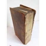 A hardbound volume of the Holy Bible dated 1823 together with a slightly smaller Book of Common