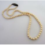 A good-quality graduated pearl necklace (The cost of UK postage via Royal Mail Special Delivery