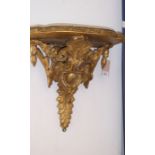 A 19th century ormolu-shaped shelf bracket ornately carved in original condition (45cm wide x 40cm x