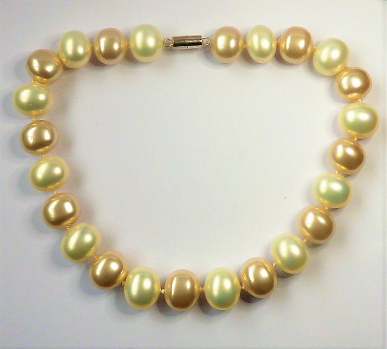 HARRIET WHINNEY; a single strand of large natural colour pearls