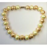 HARRIET WHINNEY; a single strand of large natural colour pearls