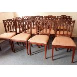 A good and long set of 12 late 18th century-style hardwood dining chairs, carved in loose Sheraton-