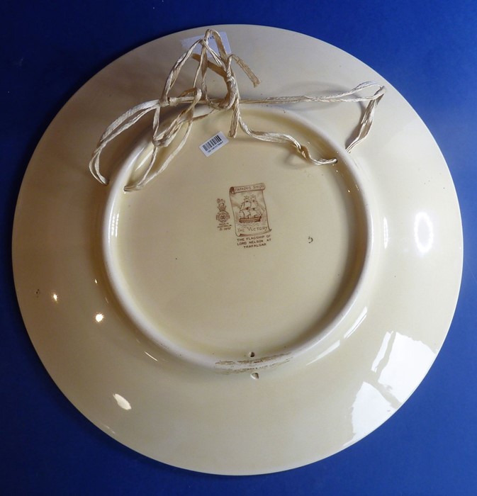 A Royal Doulton charger; 'The Victory' from the 'Famous Ships' series, printed marks to the - Image 2 of 2
