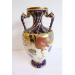 A Royal Crown Derby three-handled vase (26cm high) (at fault)