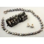 HARRIET WHINNEY; a pearl necklace with sterling silver clasp, matching earrings and an expandable
