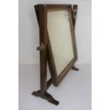 A 19th century mahogany, parcel-gilt and chequer-strung toilet mirror (39.5cm high)