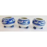 Three squat spherical-shaped Chinese porcelain bowls; each hand-decorated with birds in flight among