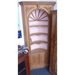 A fine 18th century style (later) freestanding pine corner cupboard; the outset cornice carved