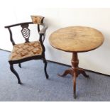 A circular-topped George III period oak occasional table with turned stem and tripod base (for