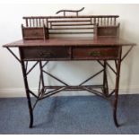 A 19th century style rosewood writing table; the superstructure with two small drawers and two