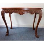 A mid-18th century style mahogany library/centre table; thumbnail-moulded top above foliate carved