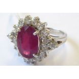 An 18-carat white-gold ruby and diamond cluster ring; ring size N ((total weight 7.71g) (The cost of