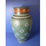 A late 19th century Mettlach porcelain vase; hand-decorated in enamels with stylised flower heads (
