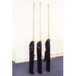 Three 57" pool cues: 2-, 3- and 4-section (two by Riley and one of straight-grain ash), each with