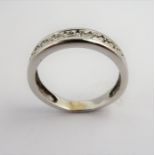An 18-carat white-gold half-eternity diamond ring: ring size J (total weight 2.4g) (The cost of UK