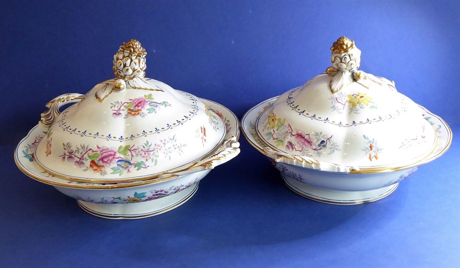 A pair of late 19th century circular two-handled tureens and covers, gilded and decorated with
