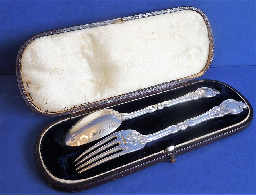 A cased hallmarked silver spoon and fork set; maker's mark GA, assayed London, probably 1854