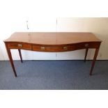 A late 18th century serpentine-fronted mahogany sideboard of large proportions; single central bow-