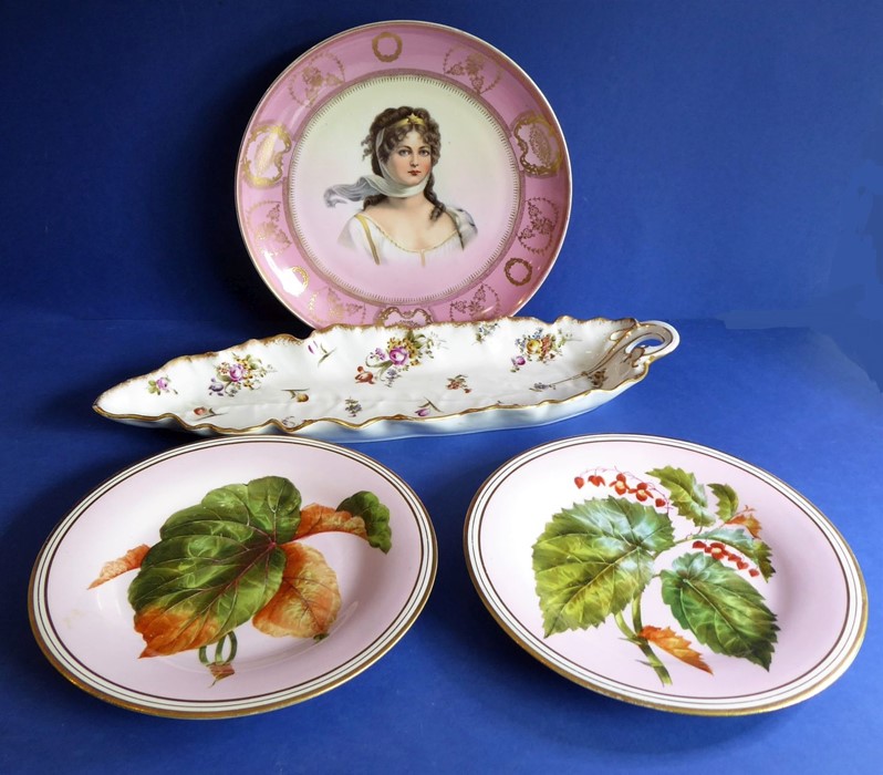 A late 19th century cabinet plate decorated with a beautiful young woman surrounded by a puce and