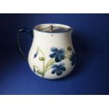 A circa 1900 MacIntyre lidded bulbous jug; showing the influence of William Moorcroft with tube-