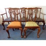 Three mid-19th century style (later) mahogany open armchairs; each with elaborately carved top
