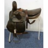 A brown-leather Coopers side saddle together with saddle stand